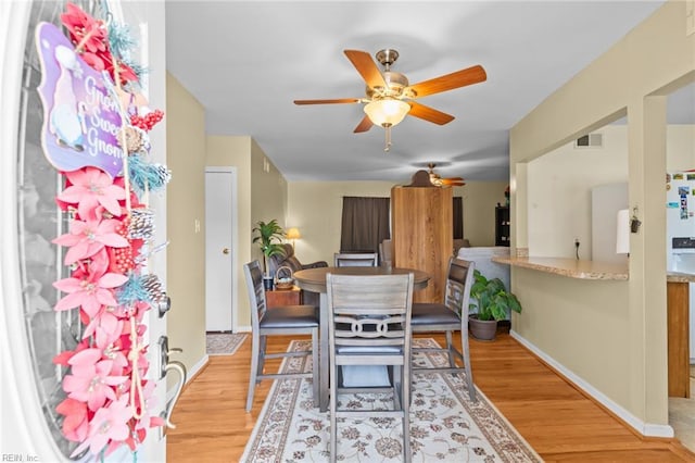8332 Halprin Dr, Norfolk, VA 23518 - dining room featuring a ceiling fan, light wood-style flooring, and baseboards