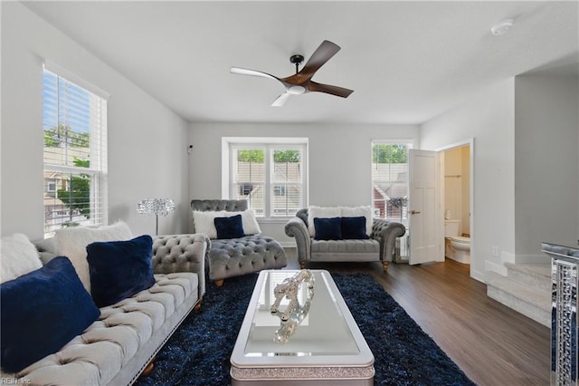 living area featuring wood finished floors and ceiling fan