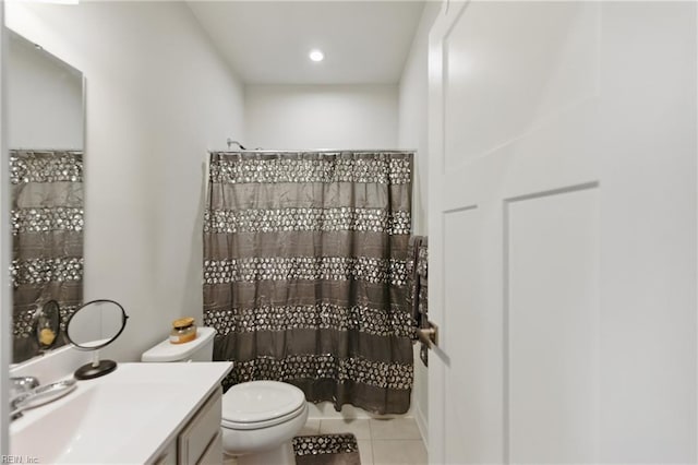 bathroom featuring tile patterned flooring, toilet, vanity, and a shower with curtain