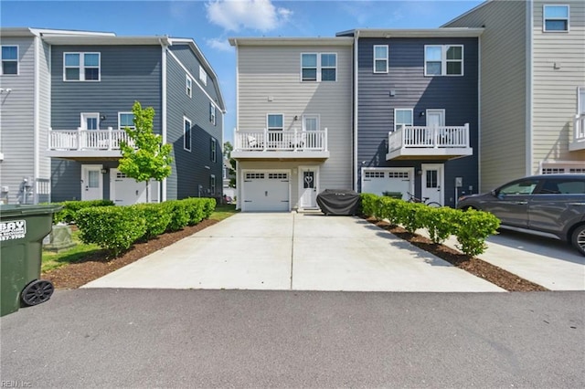 view of front of house featuring concrete driveway and an attached garage