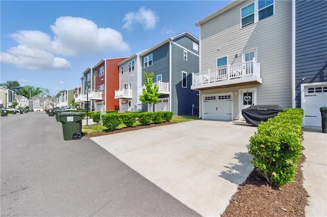 view of asphalt road with a residential view
