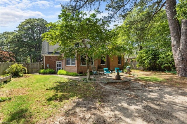 6052 Newport Cres, Norfolk, VA 23505 - rear view of house featuring brick siding and a patio