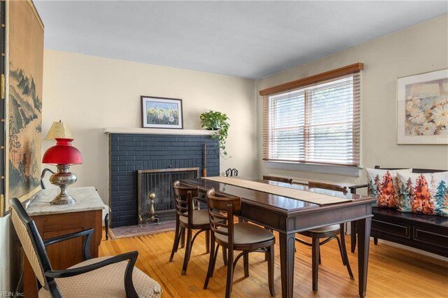 6052 Newport Cres, Norfolk, VA 23505 - dining space with a brick fireplace and light wood-type flooring