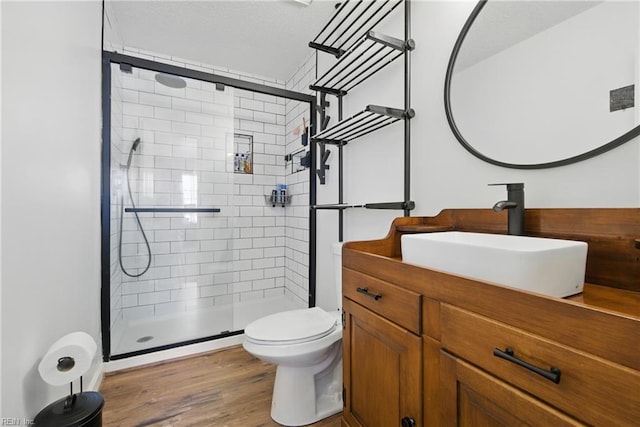 713 Quesnel Dr, Virginia Beach, VA 23454 - full bath featuring toilet, a stall shower, vanity, and wood finished floors
