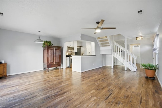 713 Quesnel Dr, Virginia Beach, VA 23454 - unfurnished living room with a ceiling fan, wood finished floors, and baseboards