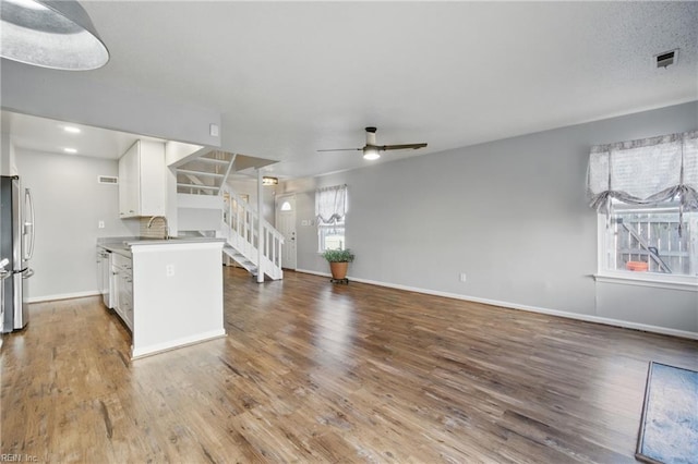 713 Quesnel Dr, Virginia Beach, VA 23454 - kitchen featuring a ceiling fan, white cabinets, wood finished floors, and baseboards