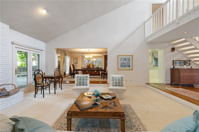 4401 Leatherwood Dr, Virginia Beach, VA 23462 - carpeted living room with high vaulted ceiling, a chandelier, a textured ceiling, stairway, and baseboards
