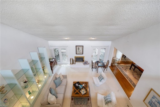 4401 Leatherwood Dr, Virginia Beach, VA 23462 - living area featuring a textured ceiling and a fireplace