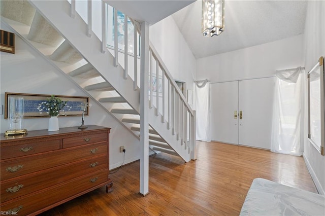 4401 Leatherwood Dr, Virginia Beach, VA 23462 - foyer with light wood-style floors, stairway, and a chandelier