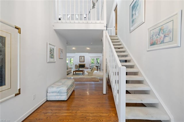4401 Leatherwood Dr, Virginia Beach, VA 23462 - stairs featuring a high ceiling, wood finished floors, and baseboards