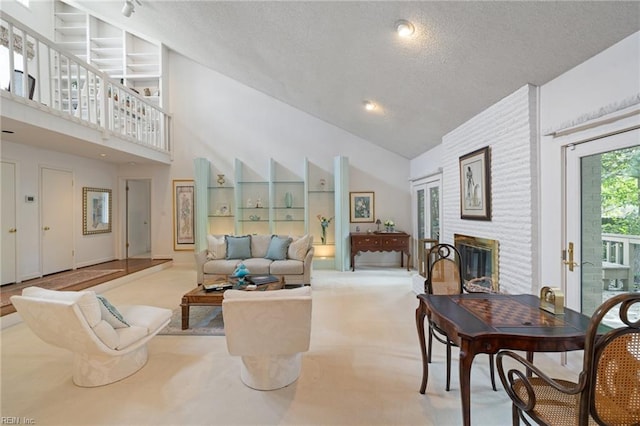4401 Leatherwood Dr, Virginia Beach, VA 23462 - living room featuring a textured ceiling, carpet, a brick fireplace, and high vaulted ceiling