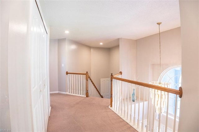 1660 Chestwood Dr, Virginia Beach, VA 23453 - hallway with an upstairs landing, carpet flooring, baseboards, a chandelier, and recessed lighting