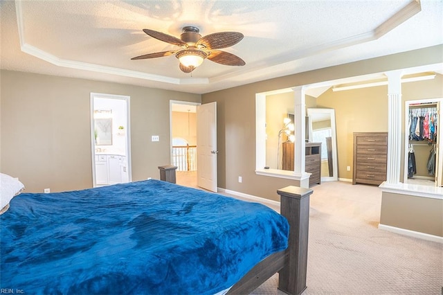 1660 Chestwood Dr, Virginia Beach, VA 23453 - bedroom with a tray ceiling, ornate columns, light carpet, baseboards, and a textured ceiling