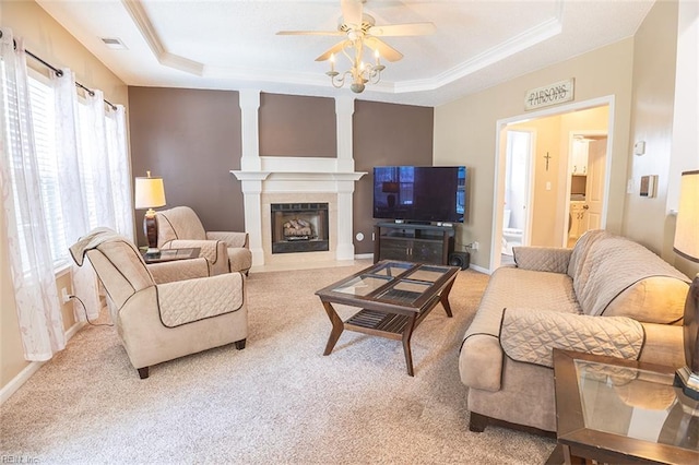1660 Chestwood Dr, Virginia Beach, VA 23453 - carpeted living area featuring a raised ceiling, ceiling fan, a fireplace with flush hearth, ornamental molding, and baseboards