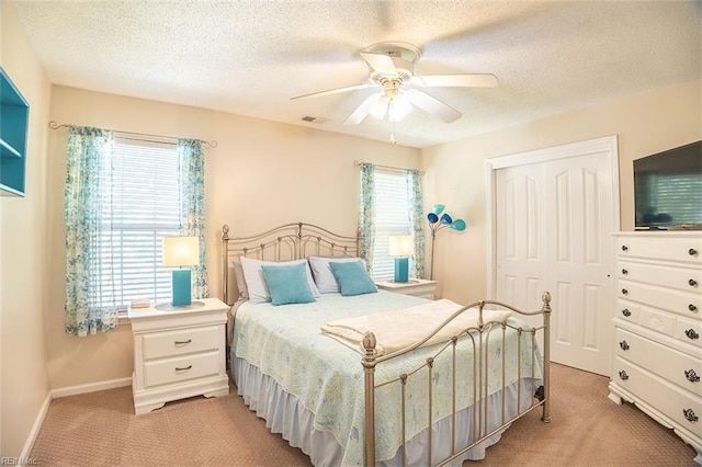 1660 Chestwood Dr, Virginia Beach, VA 23453 - bedroom featuring light colored carpet, a closet, a textured ceiling, baseboards, and ceiling fan