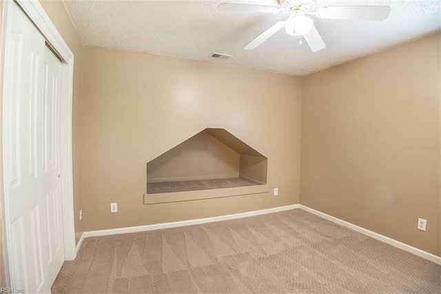 1660 Chestwood Dr, Virginia Beach, VA 23453 - unfurnished bedroom featuring carpet, a closet, a textured ceiling, baseboards, and a ceiling fan