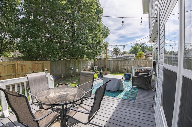 1660 Chestwood Dr, Virginia Beach, VA 23453 - wooden deck with outdoor dining space and a fenced backyard