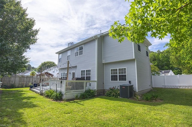 1660 Chestwood Dr, Virginia Beach, VA 23453 - back of house with central air condition unit, a deck, and a chimney