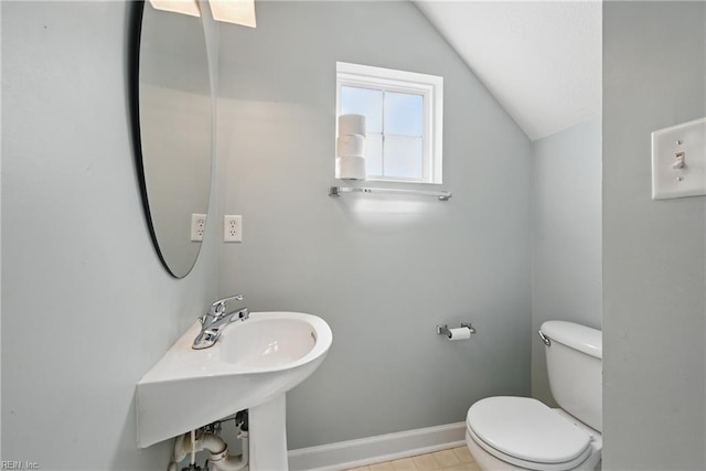 535 Normandy St, Portsmouth, VA 23701 - half bathroom with vaulted ceiling, toilet, baseboards, and a sink