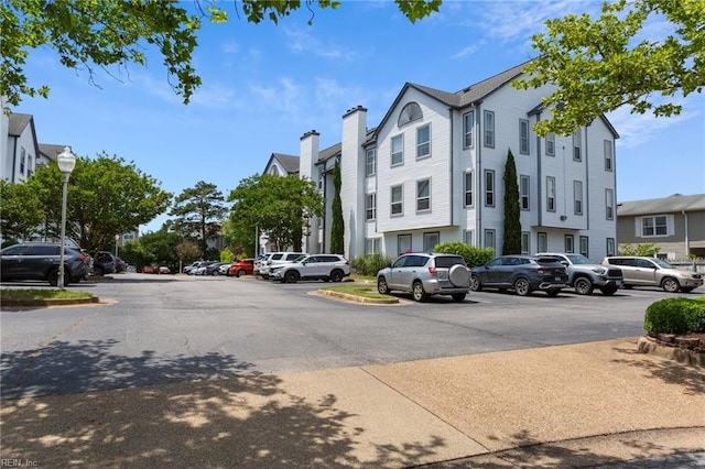 3200 Jade Ct Unit 301, Virginia Beach, VA 23451 - view of building exterior featuring uncovered parking