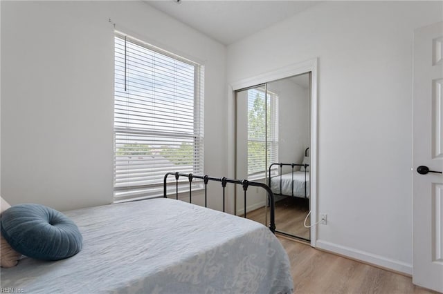 3200 Jade Ct Unit 301, Virginia Beach, VA 23451 - bedroom featuring light wood-style flooring, a closet, and baseboards