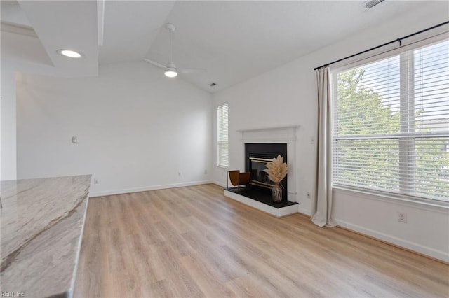 3200 Jade Ct Unit 301, Virginia Beach, VA 23451 - unfurnished living room with a ceiling fan, vaulted ceiling, light wood-type flooring, baseboards, and a glass covered fireplace