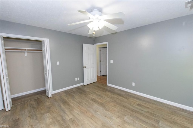 505 Plantation Rd, North, VA 23128 - unfurnished bedroom with baseboards, wood finished floors, a closet, and ceiling fan