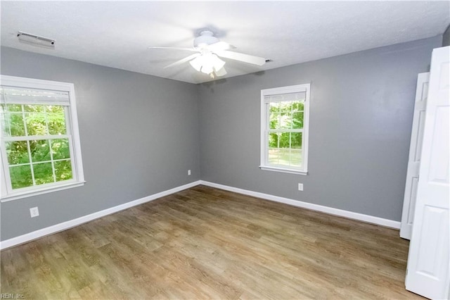 505 Plantation Rd, North, VA 23128 - unfurnished room with baseboards, a ceiling fan, and light wood-style floors