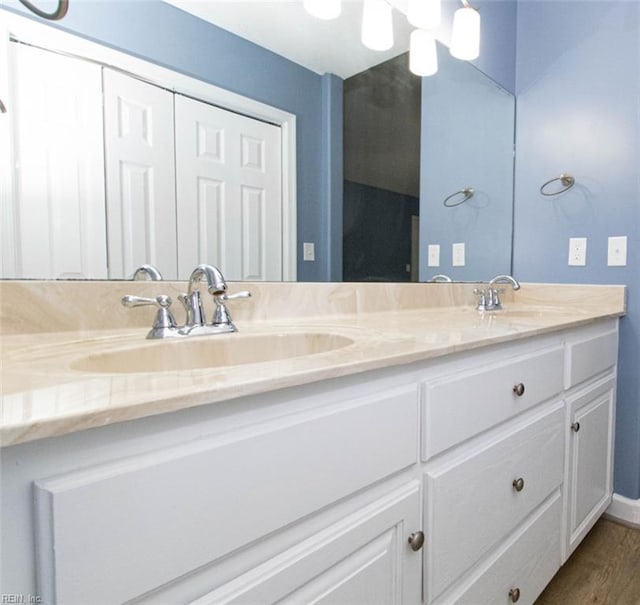 505 Plantation Rd, North, VA 23128 - bathroom with double vanity and wood finished floors