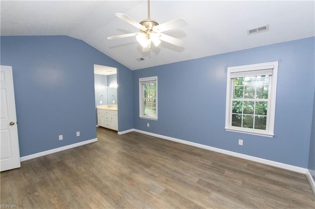 505 Plantation Rd, North, VA 23128 - unfurnished bedroom with vaulted ceiling, dark wood-type flooring, baseboards, ceiling fan, and ensuite bathroom