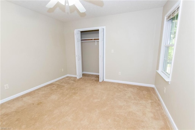 505 Plantation Rd, North, VA 23128 - unfurnished bedroom with light carpet, baseboards, ceiling fan, and a closet