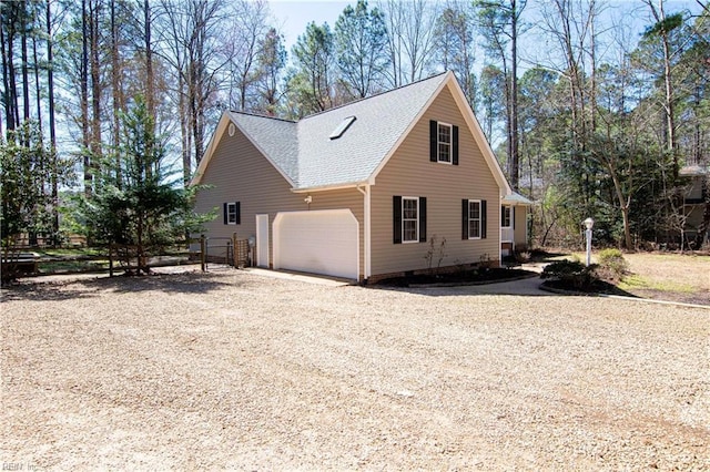 505 Plantation Rd, North, VA 23128 - view of side of home featuring a garage, driveway, a shingled roof, and crawl space