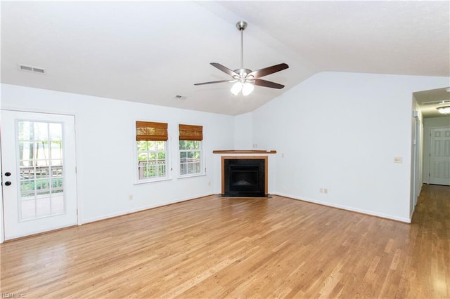 505 Plantation Rd, North, VA 23128 - unfurnished living room featuring light wood-type flooring, a ceiling fan, vaulted ceiling, a fireplace with flush hearth, and baseboards