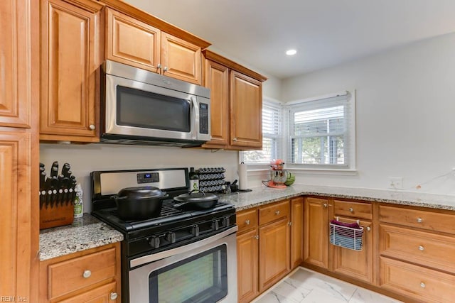 7811 Michael Dr, Norfolk, VA 23505 - kitchen featuring appliances with stainless steel finishes, light marble finish floors, light stone counters, recessed lighting, and brown cabinetry