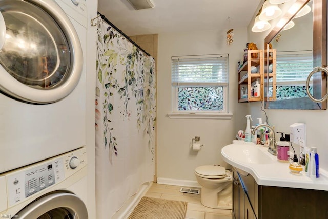 7811 Michael Dr, Norfolk, VA 23505 - full bath featuring estacked washer and dryer, tile patterned floors, toilet, baseboards, and vanity