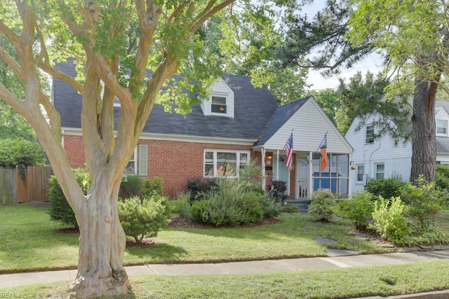 7811 Michael Dr, Norfolk, VA 23505 - new england style home with brick siding and roof with shingles