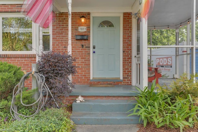7811 Michael Dr, Norfolk, VA 23505 - view of exterior entry featuring brick siding and a porch