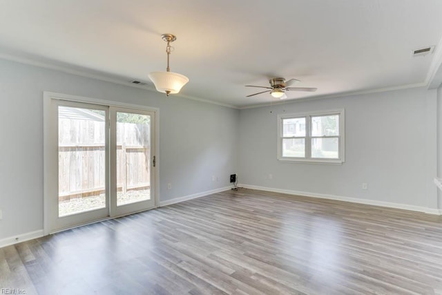 541 Mango Dr, Virginia Beach, VA 23452 - unfurnished room with healthy amount of natural light, a ceiling fan, ornamental molding, wood finished floors, and baseboards