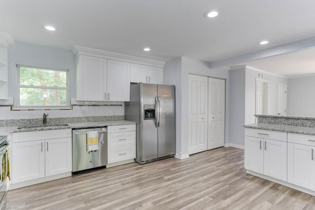 541 Mango Dr, Virginia Beach, VA 23452 - kitchen featuring stainless steel appliances, a sink, white cabinets, light wood-style flooring, and recessed lighting