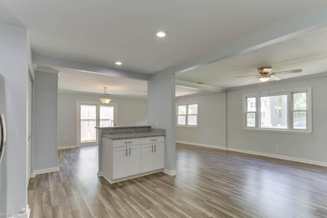 541 Mango Dr, Virginia Beach, VA 23452 - kitchen featuring open floor plan, white cabinets, baseboards, wood finished floors, and ornamental molding