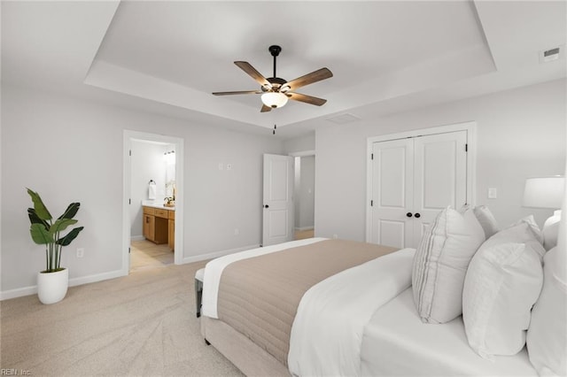 MM SC, Chesapeake, VA 23322 - bedroom with a tray ceiling, light carpet, baseboards, a closet, and connected bathroom