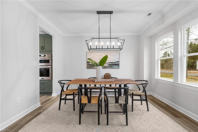 MM SC, Chesapeake, VA 23322 - dining room with wood finished floors, baseboards, crown molding, and a chandelier