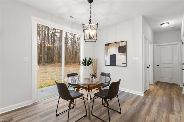 MM SC, Chesapeake, VA 23322 - dining space with a chandelier, wood finished floors, and baseboards