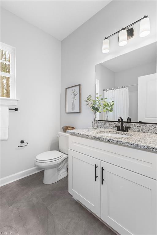 MM SC, Chesapeake, VA 23322 - bathroom with toilet, vanity, baseboards, and curtained shower