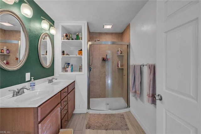 6413 Natrona Ave, Norfolk, VA 23509 - bathroom featuring a shower stall, wood finished floors, and double vanity