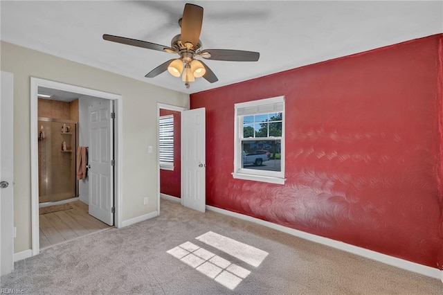 6413 Natrona Ave, Norfolk, VA 23509 - unfurnished bedroom featuring carpet floors, baseboards, ensuite bathroom, and ceiling fan