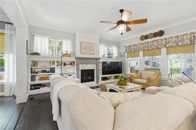 2408 Mathews Green Rd, Virginia Beach, VA 23456 - living room featuring crown molding, a ceiling fan, dark wood-type flooring, and a fireplace with flush hearth