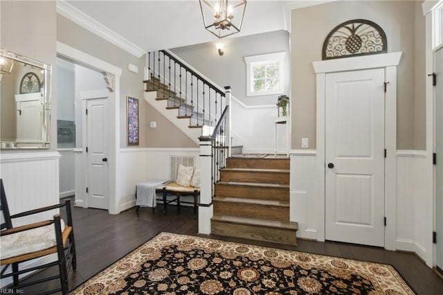 2408 Mathews Green Rd, Virginia Beach, VA 23456 - entrance foyer with wood finished floors, stairs, wainscoting, ornamental molding, and a chandelier