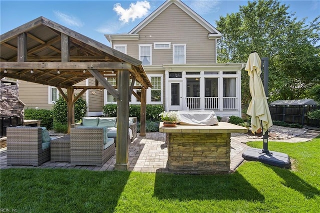 2408 Mathews Green Rd, Virginia Beach, VA 23456 - back of property featuring a patio area, outdoor lounge area, a gazebo, and a sunroom