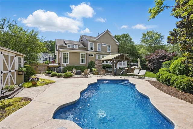 2408 Mathews Green Rd, Virginia Beach, VA 23456 - rear view of house with a patio area, a gazebo, and an outdoor pool